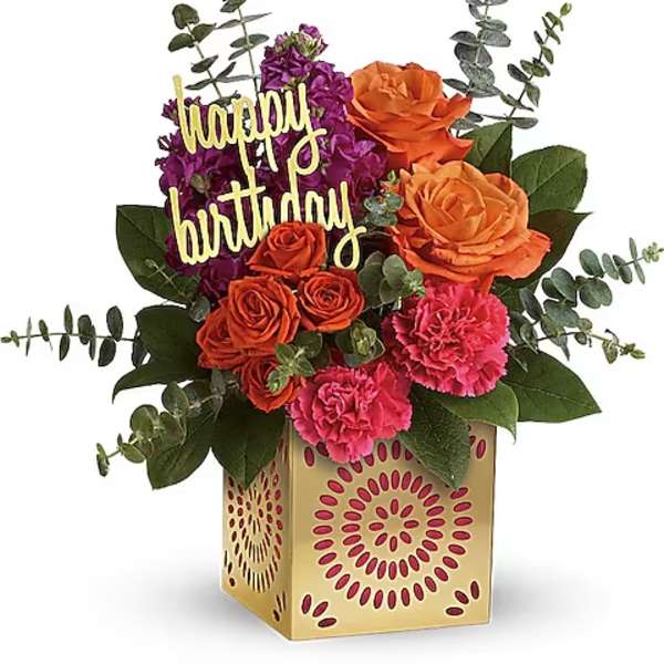 Birthday flower arrangement with roses and carnations in a decorative box