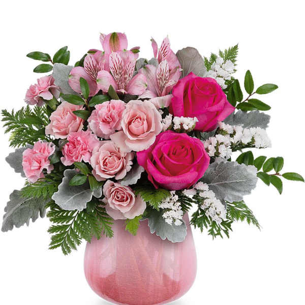 Pink roses and carnations in a pink glass vase