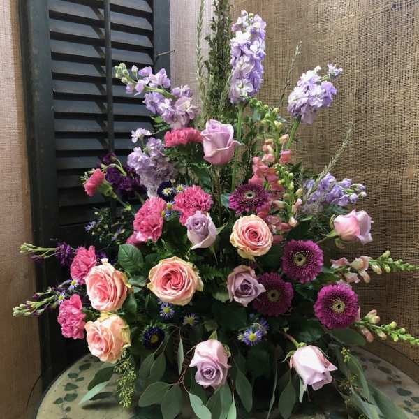Mixed bouquet of pink, lavender, and purple flowers