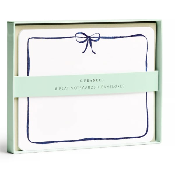 Boxed set of flat notecards and envelopes with a navy bow design