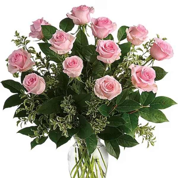 Pink roses arranged in a clear glass vase
