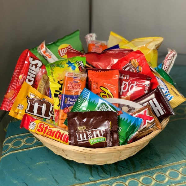 Basket filled with assorted candy bars and snack-size chocolates