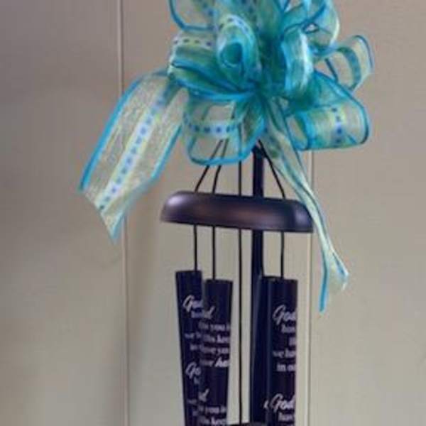 Black memorial wind chime with a blue ribbon bow