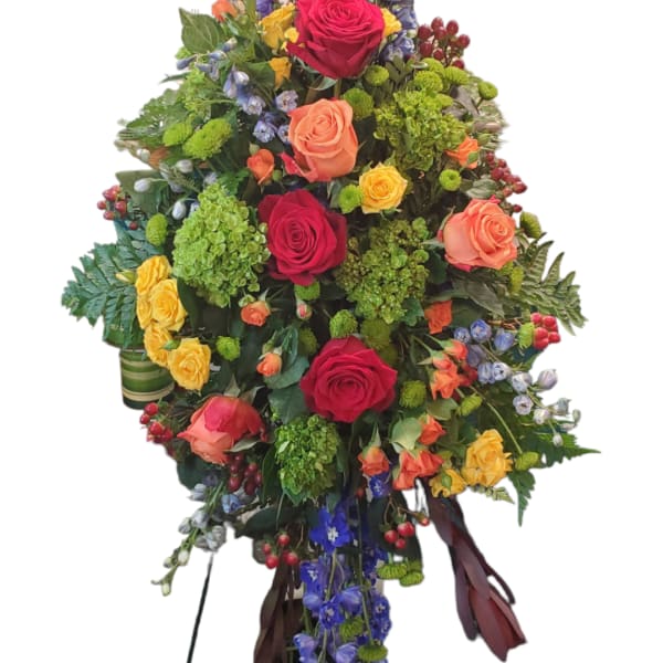 Tall floral arrangement with roses and purple hanging blooms