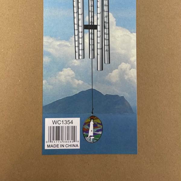 Silver wind chime hanging on a blue sky-themed card