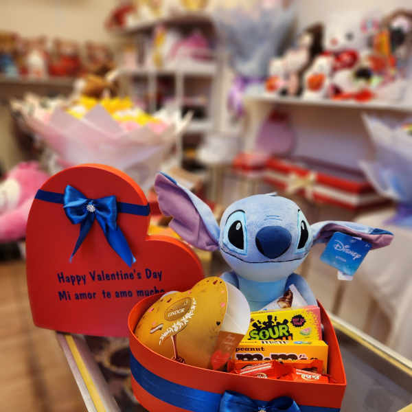 Heart-shaped gift box with candy and a Stitch plush toy