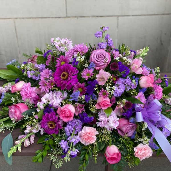 Large purple and pink floral spray with a lavender ribbon