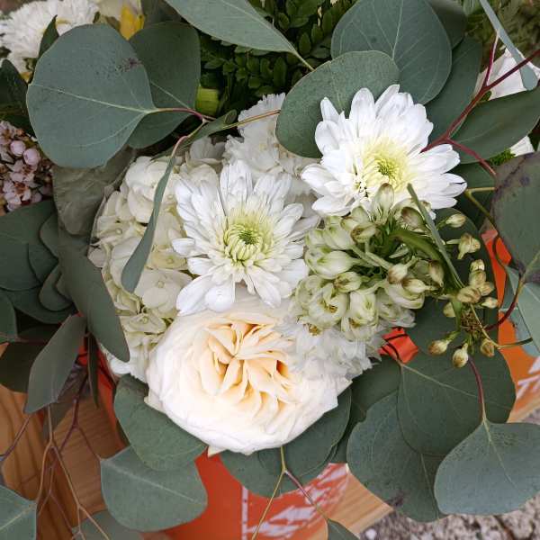 White bouquet with roses, chrysanthemums, and eucalyptus
