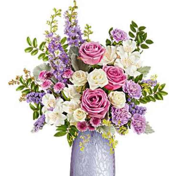 Pink and white rose bouquet in a lavender vase