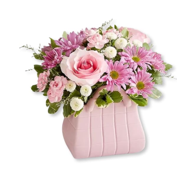 Pink and white flower arrangement in a pink vase