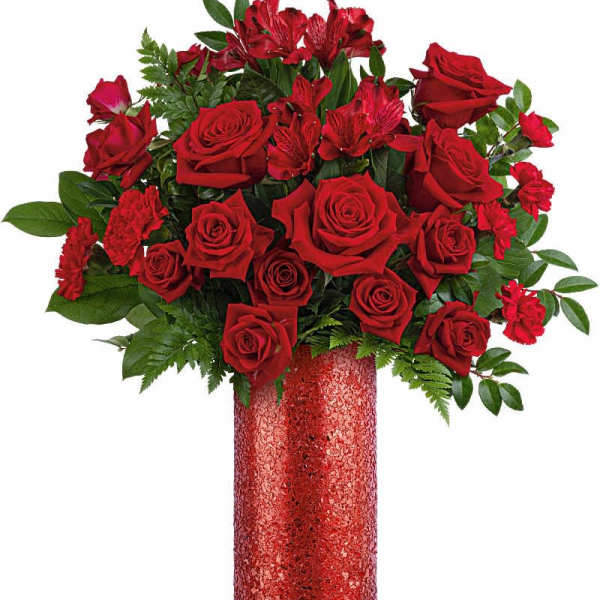 Red roses and red alstroemeria in a glittery red vase