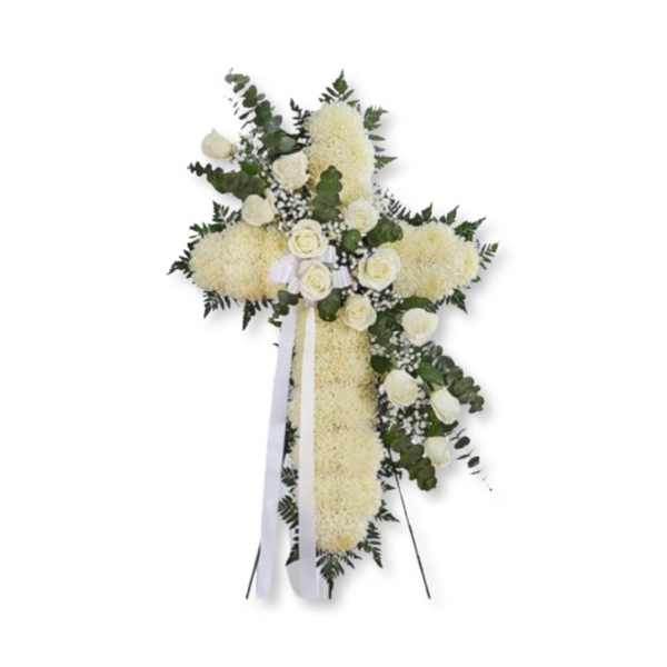White floral standing cross with roses and ribbon