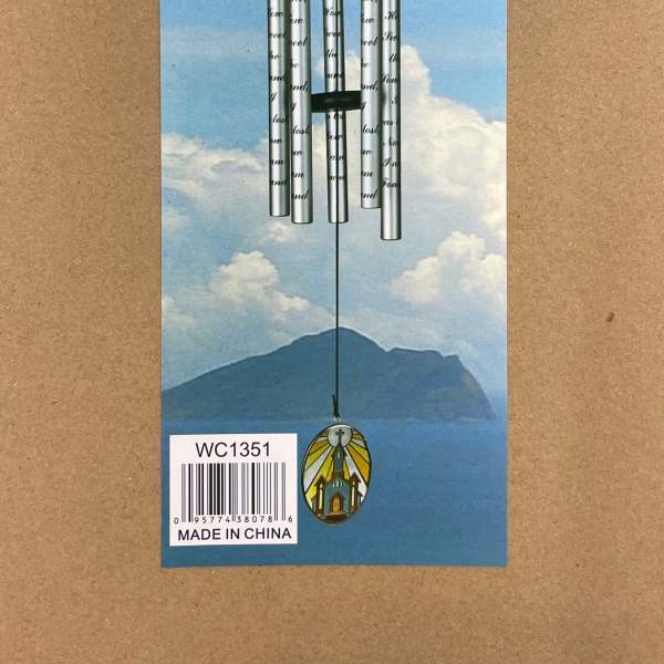 Packaged silver wind chime with a church pendant