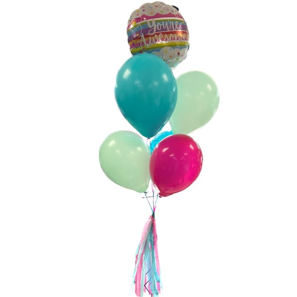 Cluster of colorful balloons with a "You're Awesome" balloon and tassels