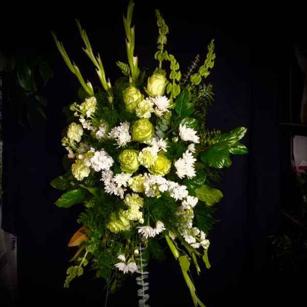 Tall green and white floral spray with mixed blooms