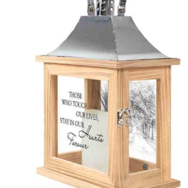 Wooden memorial lantern with a metal top and engraved tribute text