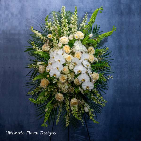 Large standing floral spray with white orchids and cream roses