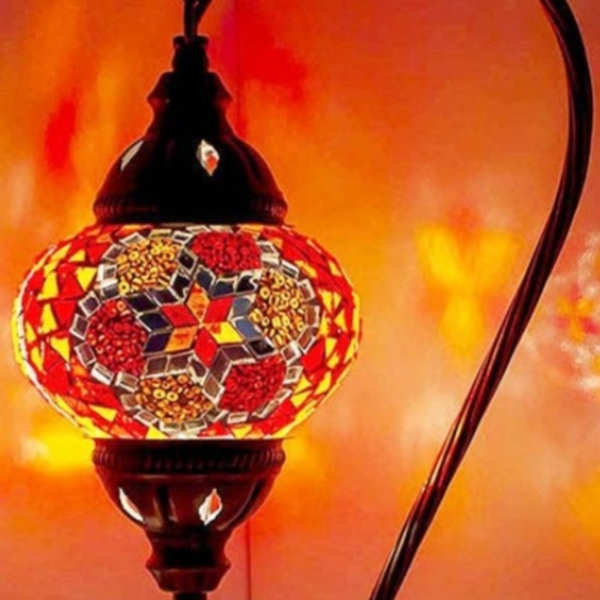 Decorative mosaic table lamp with a curved black stand