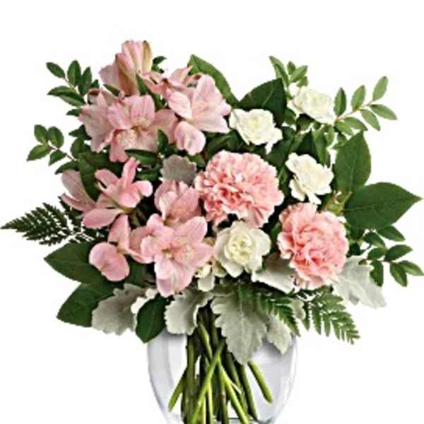 Pink and white bouquet in a clear glass vase