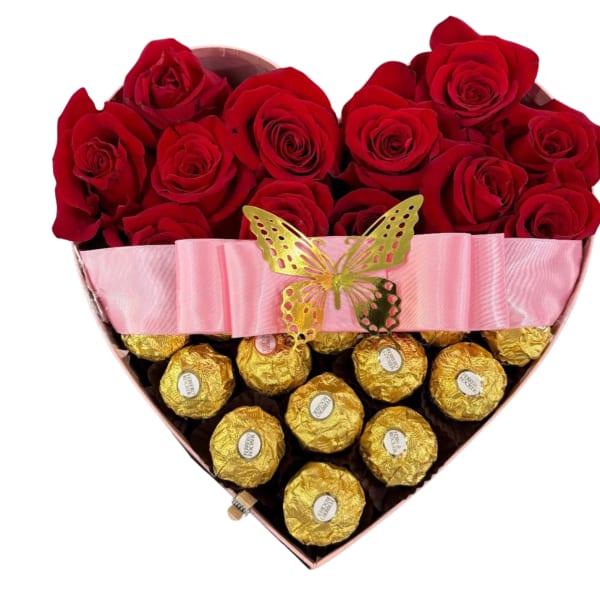 Heart-shaped box of red roses and gold-wrapped chocolates with a pink ribbon