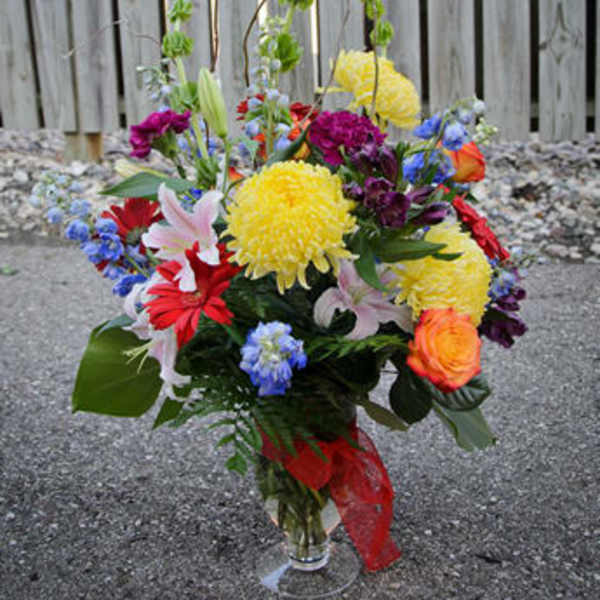 Colorful mixed bouquet in a clear glass vase