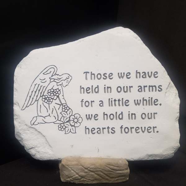 Memorial stone with an angel and remembrance quote