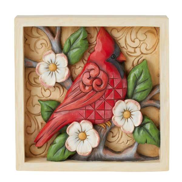 Decorative plaque of a red cardinal on a branch with white flowers