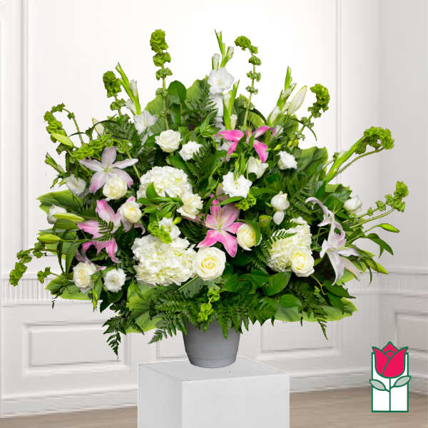 Large mixed floral arrangement in a gray vase with pink and white blooms