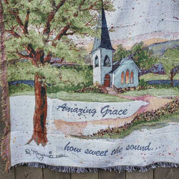 Woven blanket with a church scene and the words "Amazing Grace"