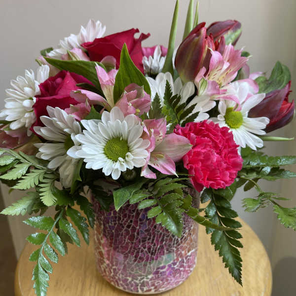 Pink and white mixed bouquet in a mosaic vase