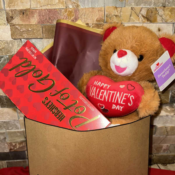 Gift bag with a teddy bear and Valentine candy box