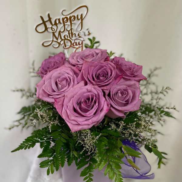 Pink rose bouquet in a lavender box with a Mother's Day topper