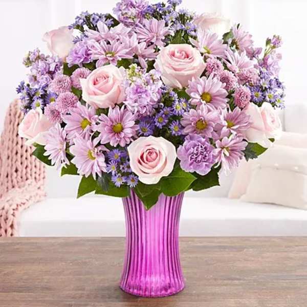 Pink and lavender bouquet in a purple vase