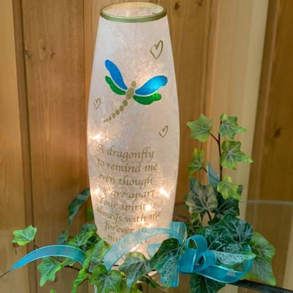 Dragonfly memorial lantern with ivy and blue ribbon