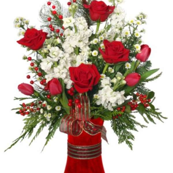 Red roses and white flowers in a red vase with ribbon