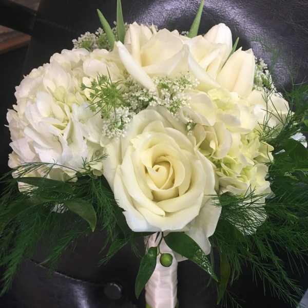 White rose and hydrangea bouquet with greenery