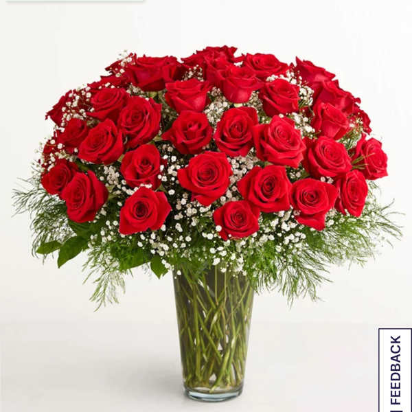 Bouquet of red roses in a clear glass vase