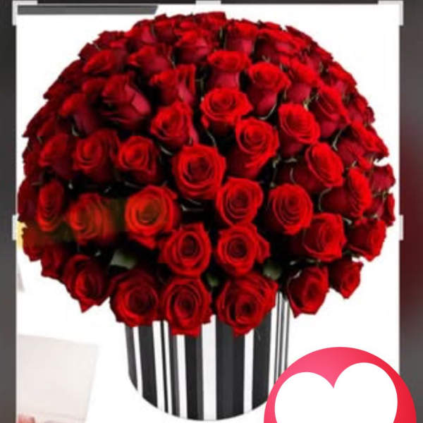 Large bouquet of red roses in a striped vase