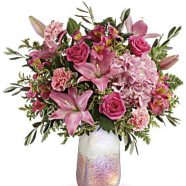 Pink mixed bouquet in a iridescent glass vase