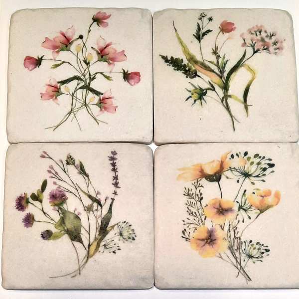 Four square floral coasters with watercolor-style wildflower designs