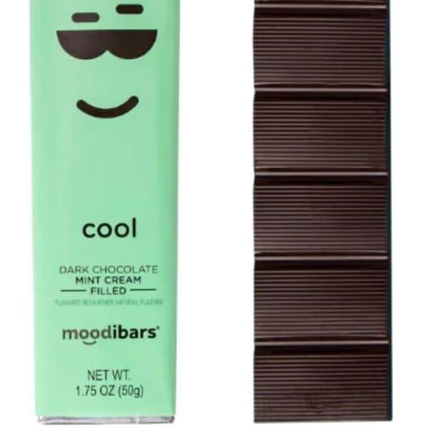 Mint chocolate bar in green wrapper beside a dark chocolate bar