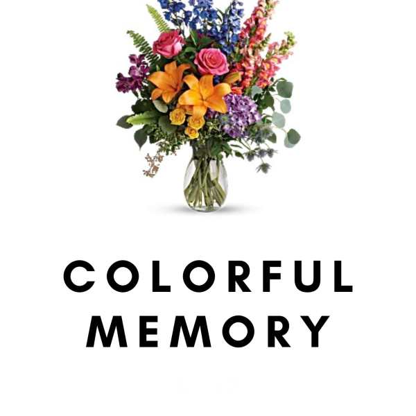 Colorful mixed flower arrangement in a glass vase