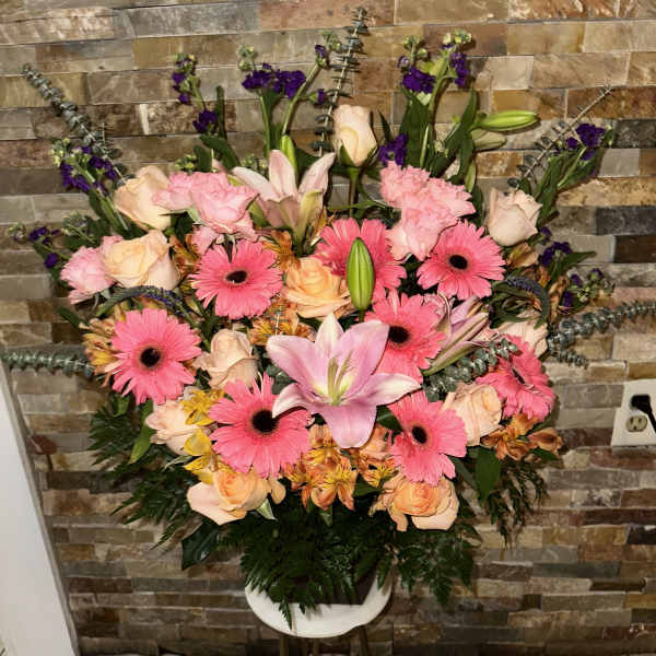 Large pink and peach floral arrangement with lilies and gerbera daisies