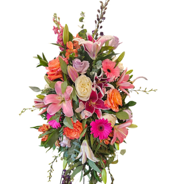 Tall standing floral spray with pink lilies, roses, and gerbera daisies
