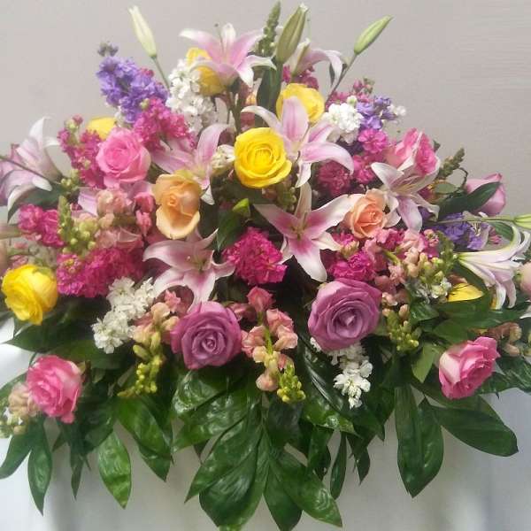 Large mixed bouquet of pink, yellow, and white flowers