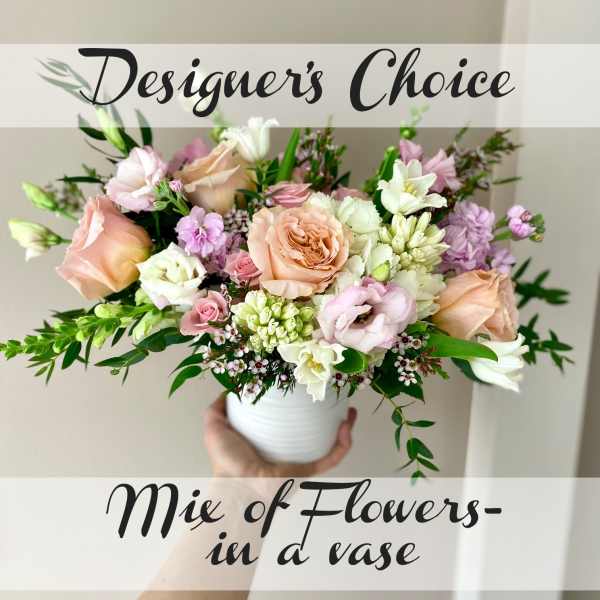 Mixed pastel bouquet in a white vase