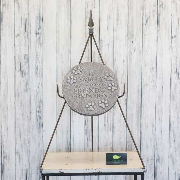 Memorial plaque on a metal stand with paw prints