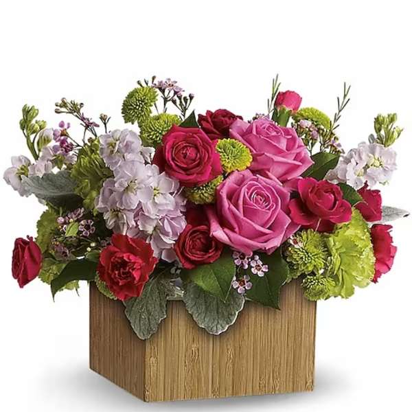 Pink and red rose arrangement in a wooden box