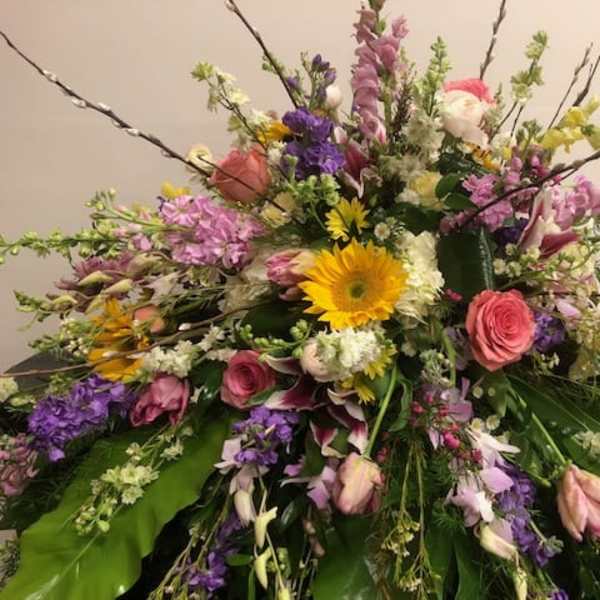 Large mixed floral spray with pink, purple, yellow, and white blooms