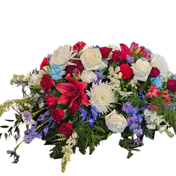Large mixed floral spray with red, white, and blue flowers